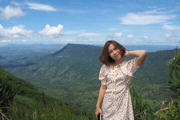 Fototapeta premium Woman and natre at Phu Tab Berk, Petchaboon, Thailand.