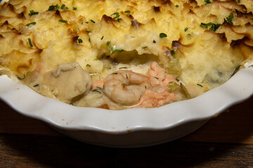A delicious fish and seafood pie, topped with golden brown mash potato