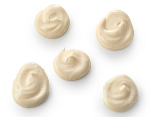Five decorative twirls of creamy mayonnaise
