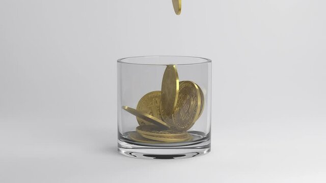 Gold coins fall into a glass goblet.