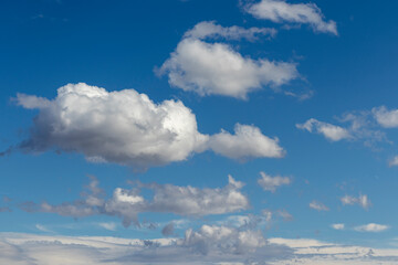 Blue sky with white clouds for backgrounds and compositing