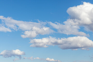 Blue sky with white clouds for backgrounds and compositing