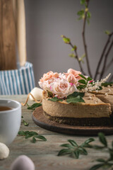 Delicious and beautiful raw cake decorated with tenderness fresh flowers. Concept of romantic mood and spring atmosphere