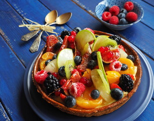OLYMPUS Cake with berries and exotic fruits - raspberry, blueberry, red currant, kiwi, apple, strawberry, orange, mangoCAMERA
