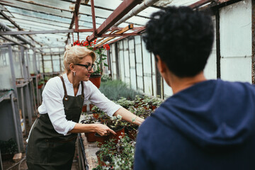 woman garden worker in green center