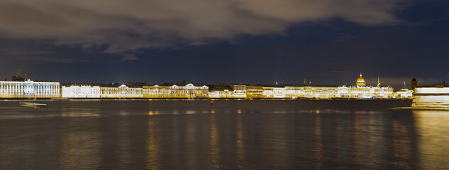 Fototapeta na wymiar View of the Palace Embankment across the Neva River in St. Petersburg.