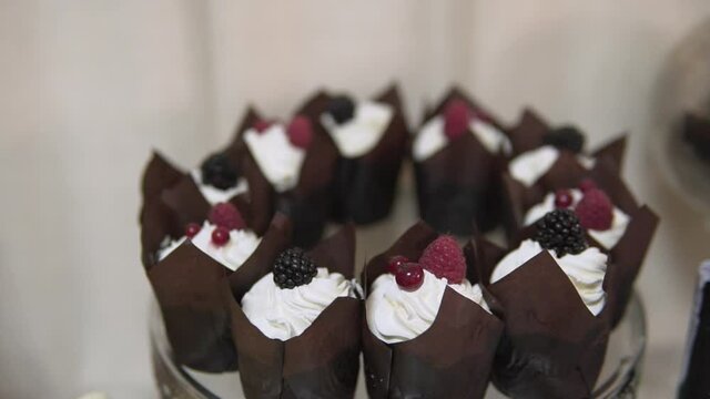 lots of sweet cakes on the buffet table