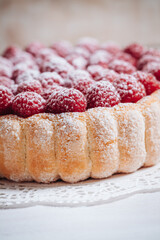 Delicious french Charlotte cake with raspberries