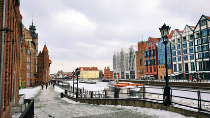 Gdansk, Poland - February 7, 2021: Old Town of Gdansk in Poland with Motlava river, Poland. Winter scenery.