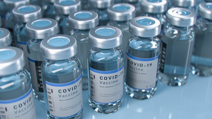 SARS-COV-2 COVID-19 Coronavirus Vaccine Mass Production in Laboratory, Bottles with Branded Labels...