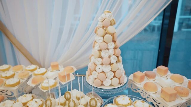 lots of sweet cakes on the buffet table