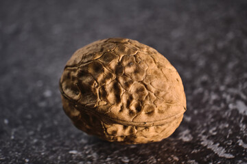 Walnut close up macro on black background.