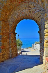 ancient gate of the Castle of Castiglione della Pescaia, a famous medieval town overlooking the...