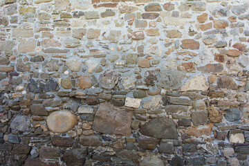 Castle wall made of old stones textures for design and photo background.