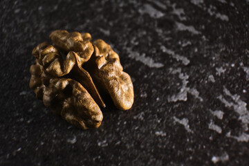 Walnut close up macro on black background.