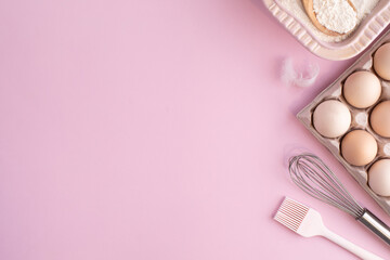 Frame of food ingredients for baking on gently pink pastel background. Cooking flat lay with copy space. Top view. Baking concept. flat lay