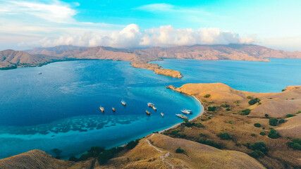 Fototapeta na wymiar Aerial iew of Gili Laba or Lawa Darat located in Komodo National Park, Labuan Bajo, Indonesia. Strong current can be seen entering into the channel