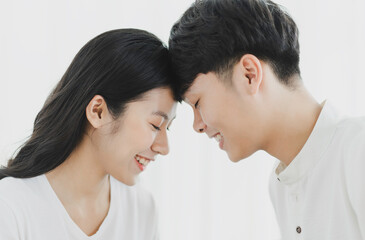 The young couple sat facing each other on the sofa