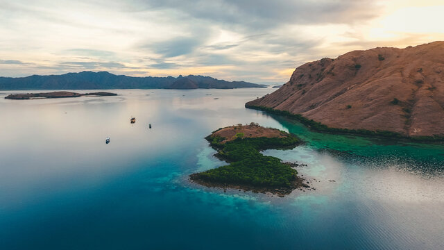 Aerial view of calm sea with sailing boat in Kalong Island, Komodo National Park, Labuan Bajo, Indonesia