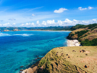 Landscape of green hills and blue sky and sea in Merese Hill, Lombok, Indonesia