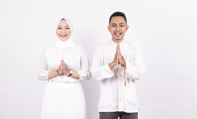 Asian moslem couple greeting gesture on ramadhan isolated