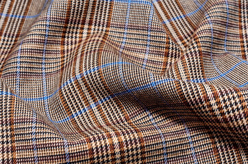 Checkered fabric. The checkered pattern on the fabric is made of different colors. Material for clothing