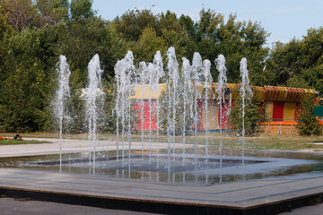 water flowing in the fountain, vertical water jets