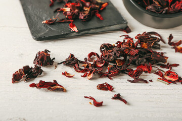 Dry hibiscus tea on white table © Pixel-Shot