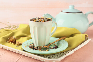 Cup with dry fruit tea on tray