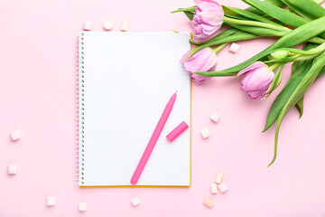 Empty notebook with beautiful tulip flowers on color background