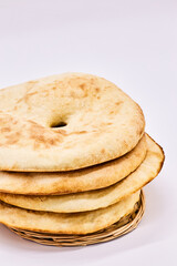 Highlight the Arabic Bread - Lavash-on a white background. Four pita bread, simple bread to eat