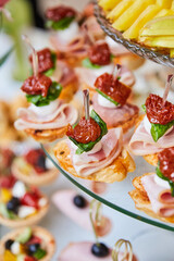 Banquet service, restaurant on departure. Food, snacks with meat, ham, ham, bread and tomatoes