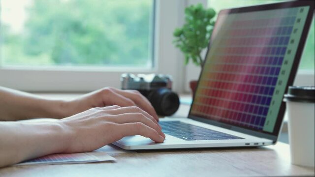 close up. graphic designer works on a laptop.