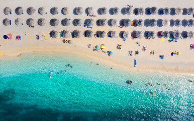 Mediterranean sea. Aerial view on beach and umbrellas. Vacation and adventure. Beach and blue water. Top view from drone at beach and azure sea. Travel and relax image