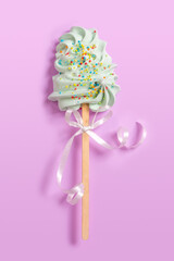 Sweet lollipop on a gentle pastel pink background
