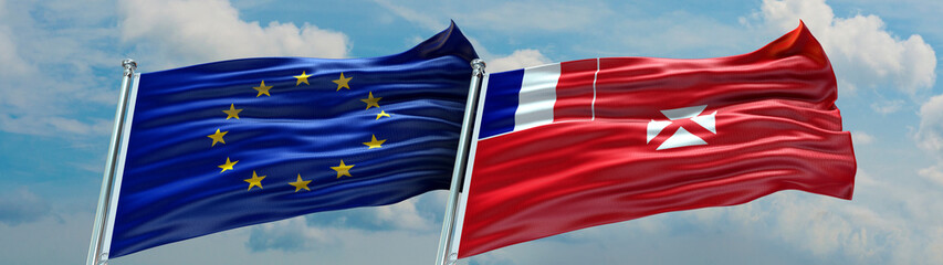 European Union Flag and Wallis and Futuna flag waving with texture and Blue cloudy sky Double flag