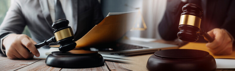 justice and law concept.Male judge in a courtroom on wooden table and Counselor or Male lawyer working in office. Legal law, advice and justice concept.