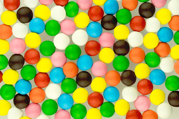 Rainbow bright candies. Cheerful colorful childrens yummy background