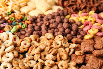 Heap of tasty breakfast cereals as background