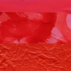 Red and brown torn paper collage close-up. Texture made from various paper and cardboard parts. Damaged old paper background. Vintage blank wallpaper. Material design backdrop.