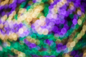 Colorful blurred background with bokhe effect for Mardi gras. Real photo.