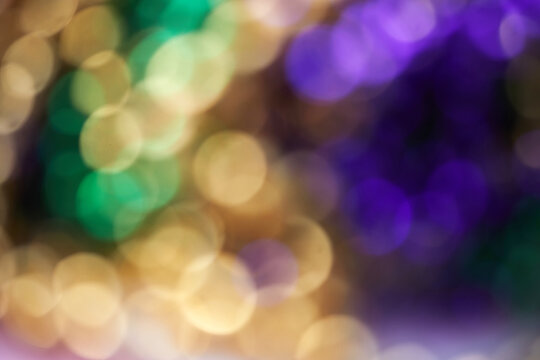 Colorful blurred background with bokhe effect for Mardi gras. Real photo.