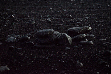 low key rocks on black sand beach