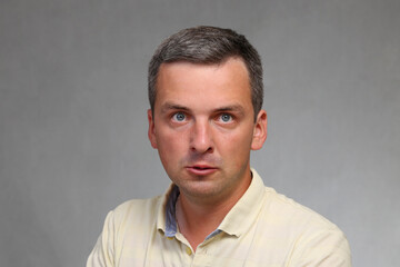 Crazy guy. Man with suspicious look of schizophrenic. Portrait of a neurotic. People react negatively to problems.