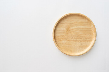 Top view of wooden dish for kitchen background. Close-up.