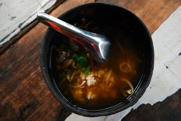 Soto batok. Batok soup is a soup served in a coconut shell bowl. Yogyakarta typical shell soup