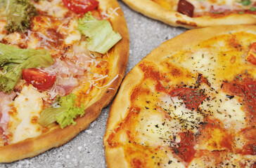 Delicious pizza on grey background.
