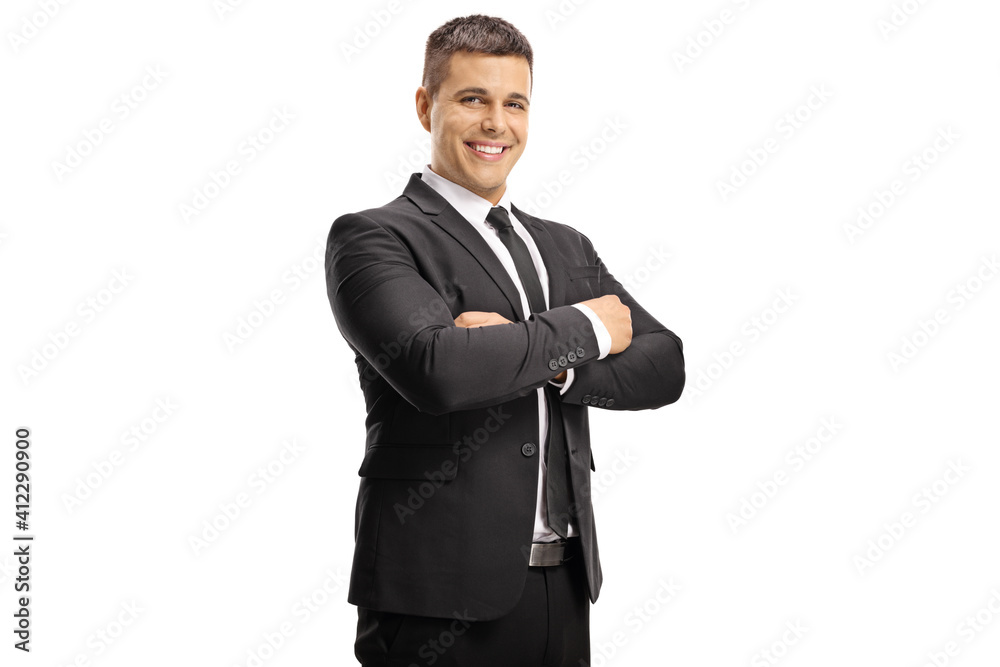 Wall mural handsome young businessman smiling at camera