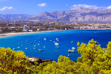 Obraz premium Beautiful south view with sea, town, mountains and yachts