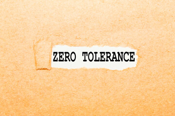 text ZERO TOLERANCE on a torn piece of paper, business concept